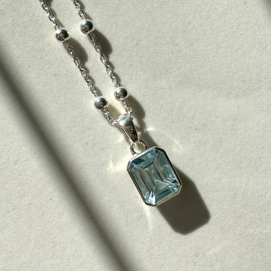 Sterling Silver Emerald Fancy Cut Blue Topaz Rubover Pendant