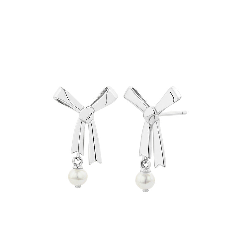 KAREN WALKER - STERLING SILVER LARGE BOW WITH PEARL STUD EARRINGS