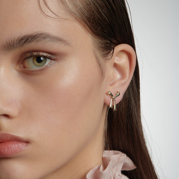 KAREN WALKER - STERLING SILVER BOW STUDS