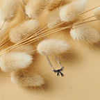 KAREN WALKER - STERLING SILVER MINI BOW NECKLACE